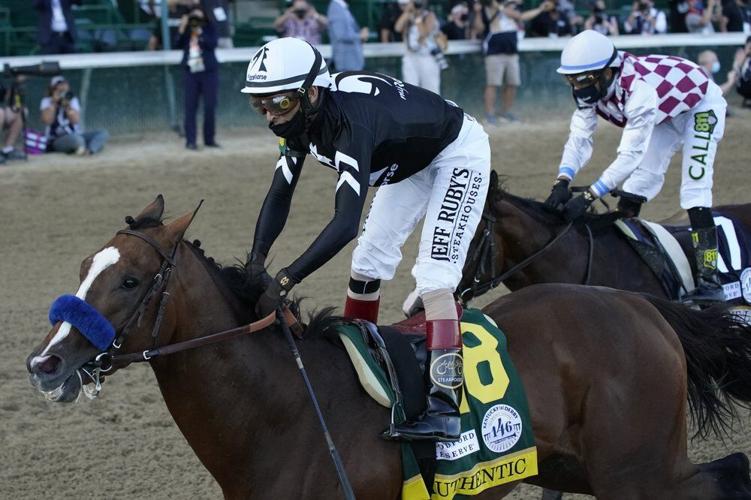 Authentic crosses the finish line ahead of Jockey Manny Franco riding Tiz the Law