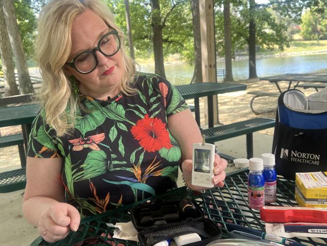 Stacy Cauley checks glucose levels