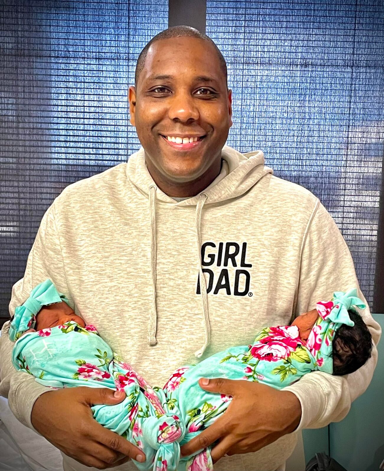 Gilbert Corsey with new twins Grace and Gabrielle