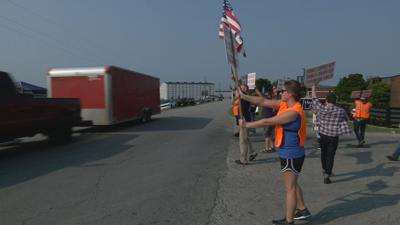 Heaven Hill Strikers hold signs