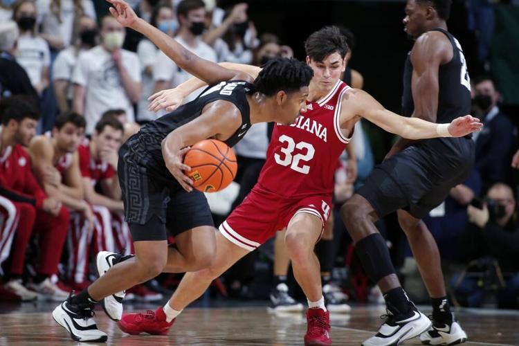 Michigan State's AJ Hoggard drives against Indiana's Trey Galloway.jpeg