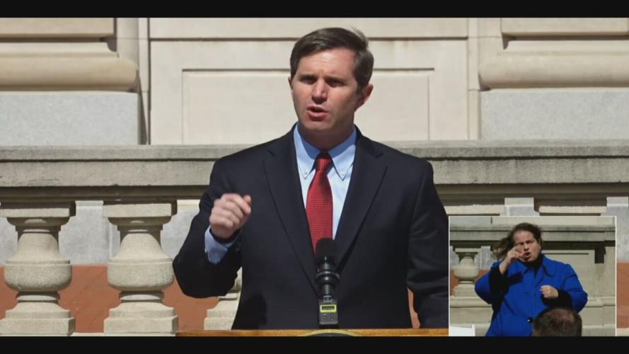 Gov. Andy Beshear speaks during a memorial ceremony