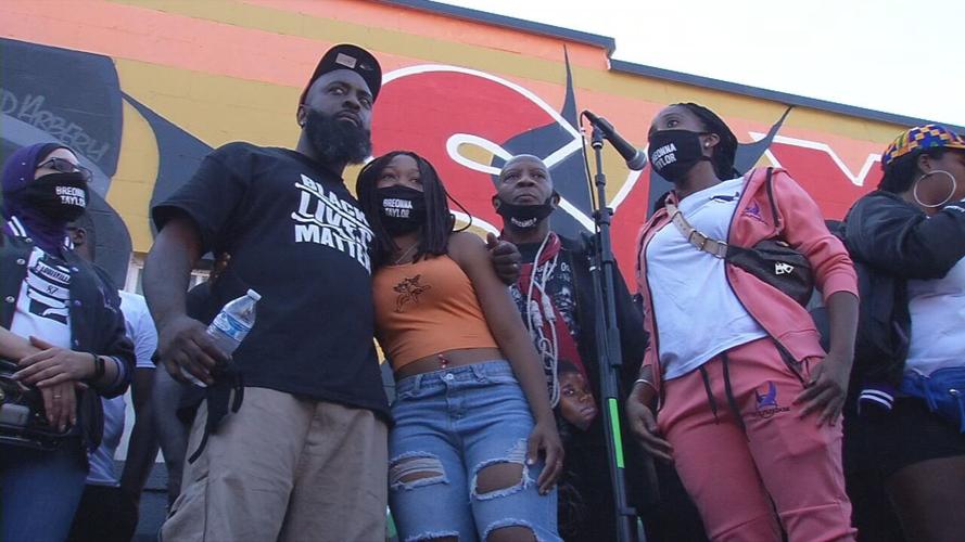 Michael Brown Sr. hugs Breonna Taylor's sister