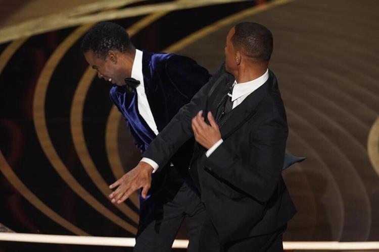 Will Smith hits presenter Chris Rock