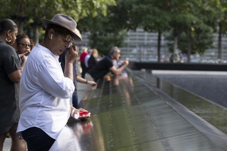 9-11 anniversary - woman wipes tears.jpeg
