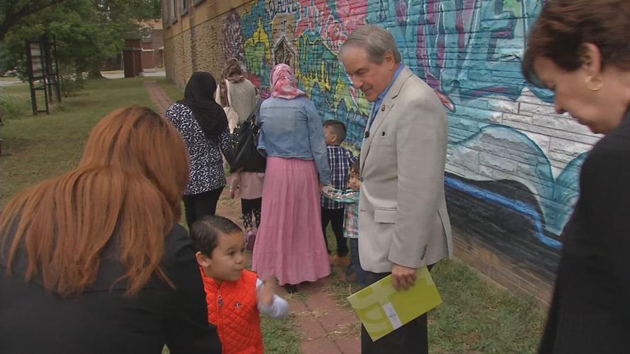 Immigrants performing a service project at Americana Community Center