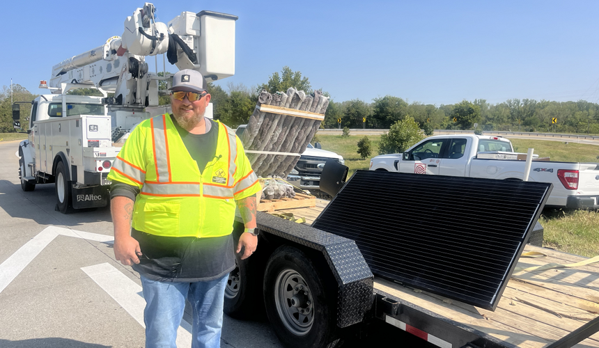 KYTC worker installing solar lights