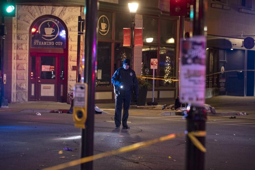 Police Officer Looks For Evidence After Waukesha Parade Massacre ...