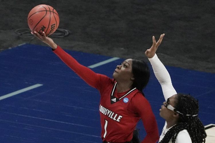 Louisville's Dana Evans shoots past Stanford's Francesca Belibi