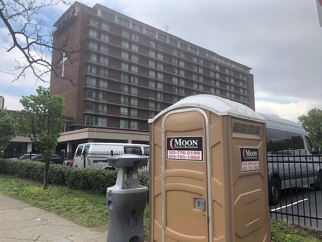 Hand-washing station and portable toilet at 1st Street and Broadway