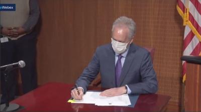 FISCHER SIGNS EXEC ORDER RACISM HEALTH CRISIS 12-1-2020.jpg