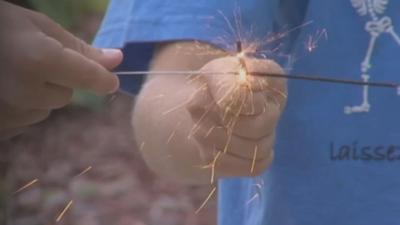 Child lights sparkler