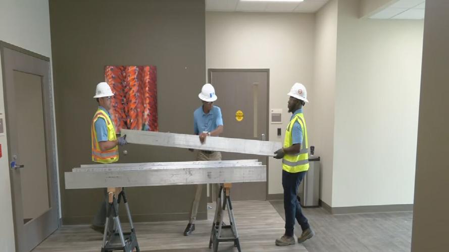 Norton construction crews with symbolic beams