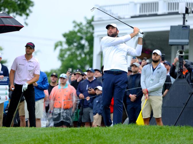 Scottie Scheffler hits an iron on tee box.JPG