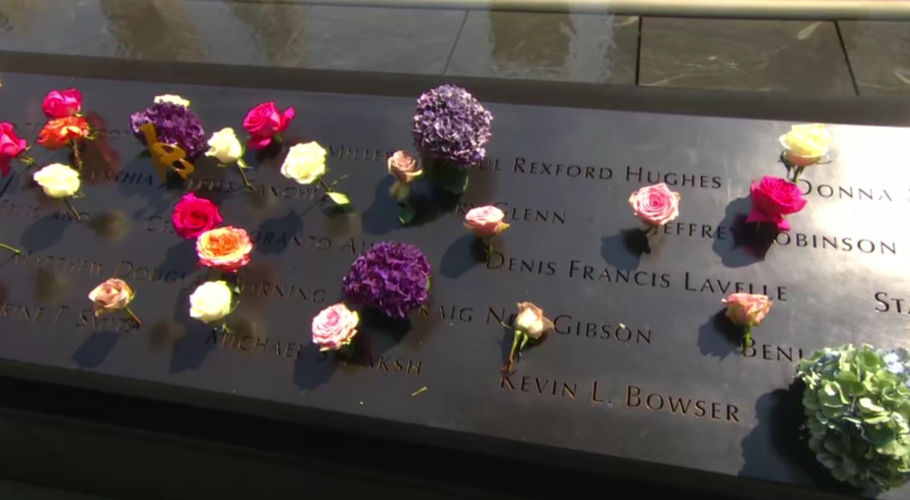 911 Memorial - Flowers on Etched Names.png