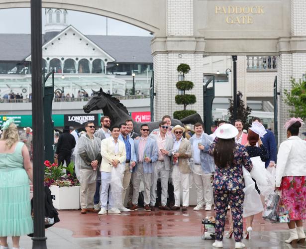Group of men take photo by Paddock.JPG