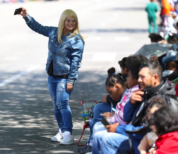 Woman takes selfie at parade.JPG