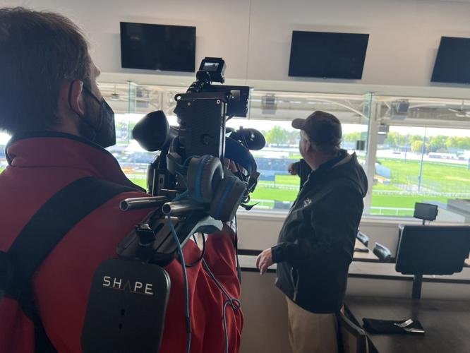 Tour Guide Barry Northern walks through Churchill Downs
