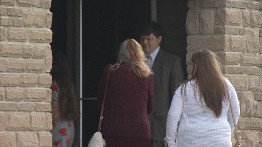 Man holds the door for women at Maryville Baptist Church