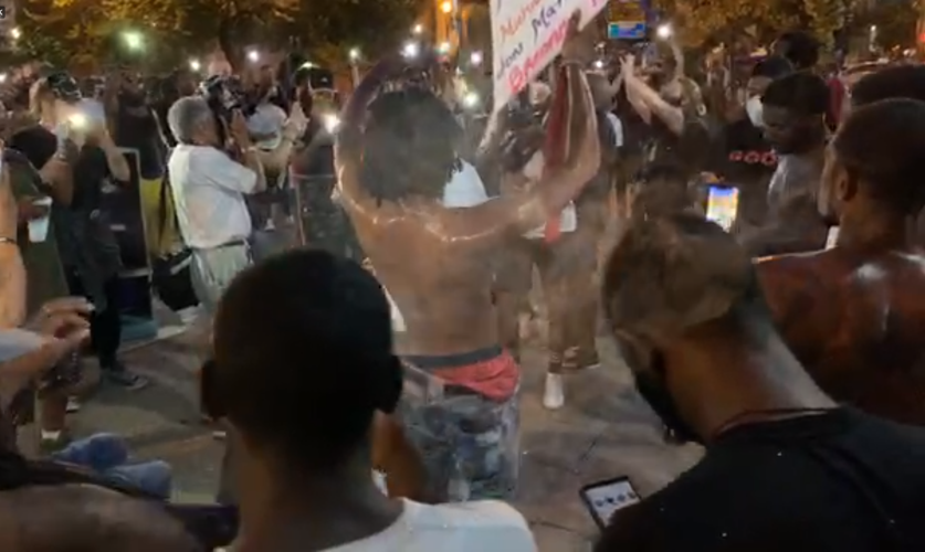 People dance during protests in Jefferson Square Park