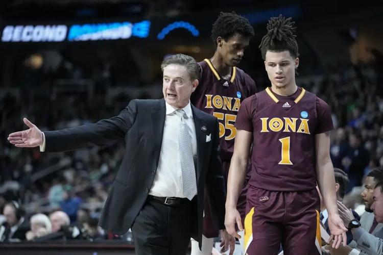 Iona head coach Rick Pitino speaks with Walter Clayton Jr..jpg
