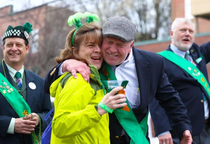 Two people hug at St. Patrick's Day Parade.JPG