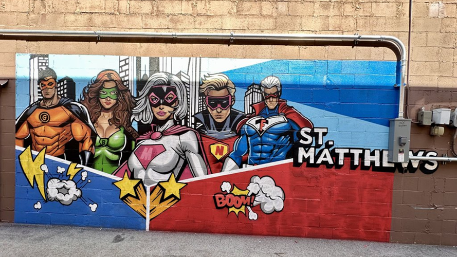 Super hero mural on Pizza Jones storefront