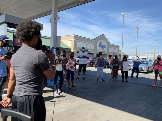 Faith leaders hold prayer service in the parking lot of looted Kroger