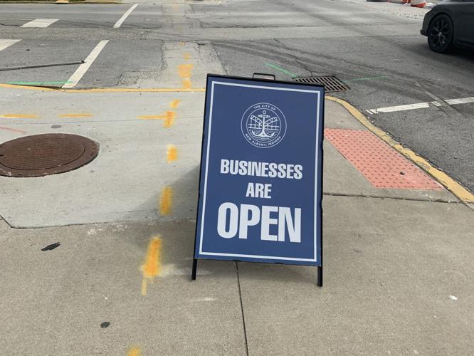 Businesses are open sign on Main Street in downtown New Albany