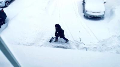 Cynthia Reyes (wife of Canadian politician Jon Reyes) shoveling snow