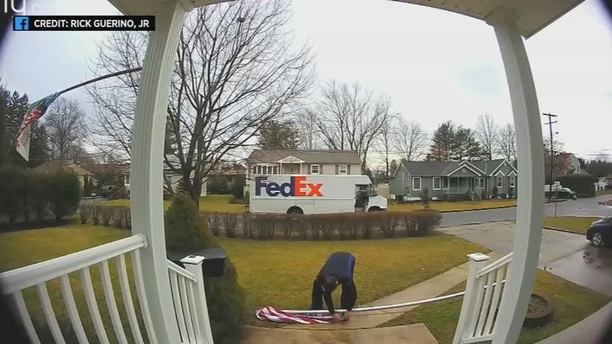 FEDEX WORKER STOPS TO FOLD FLAG 1130 VO