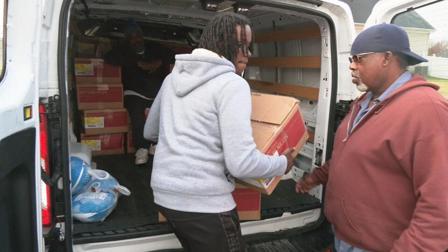 Louisville's Community Connections Group delivers frozen turkeys and chicken to community members ahead of the Thanksgiving holiday