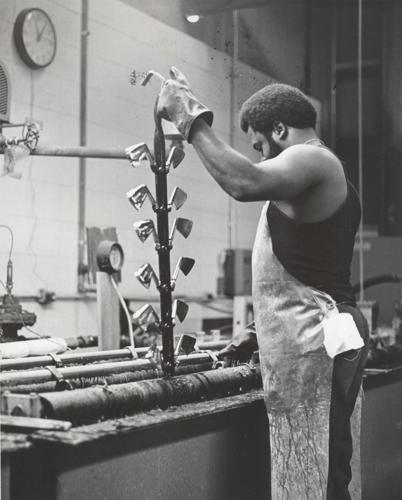 Unidentified Hillerich & Bradsby Co. employee manufacturing golf clubs