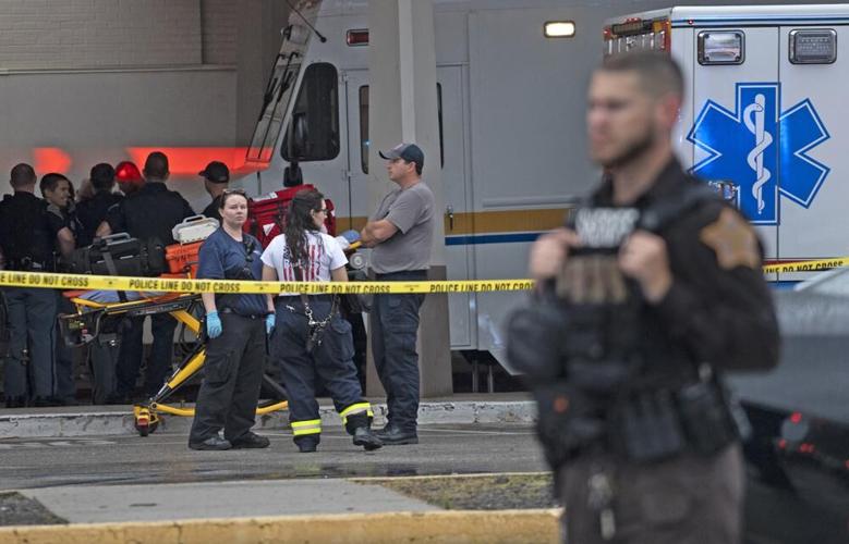 Emergency personnel gather after a deadly shooting at Greenwood Park Mall.jpeg