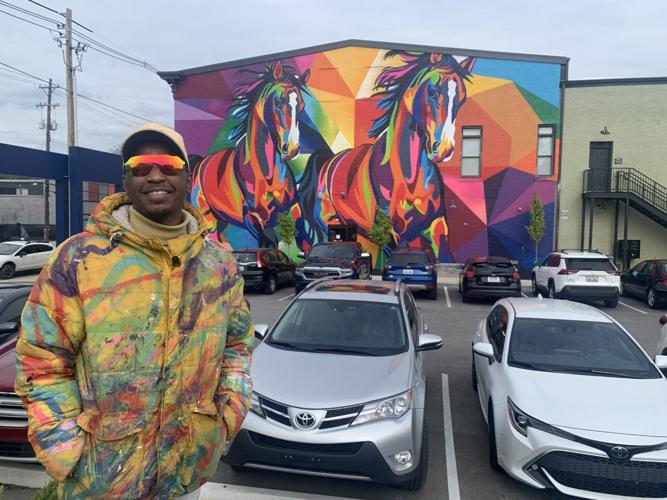 Kacy Jackson with The Unified Race mural.jpg