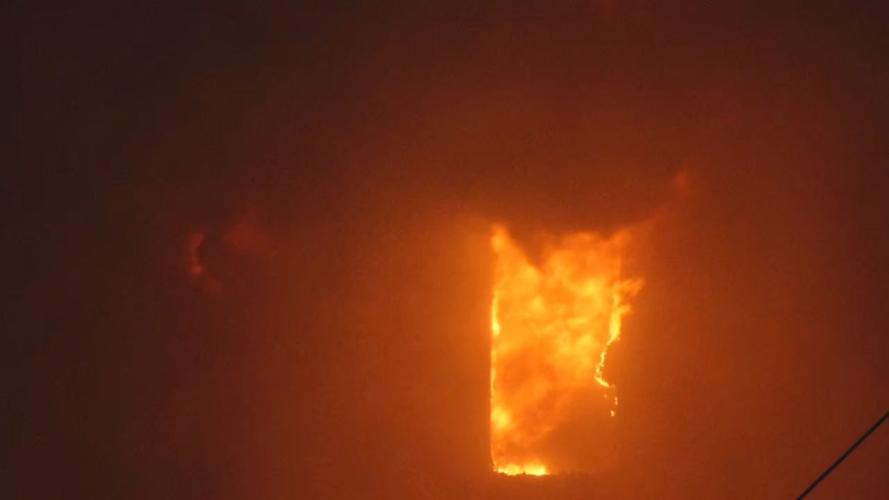 30TH AND ALI FIRE - CU of flames in window