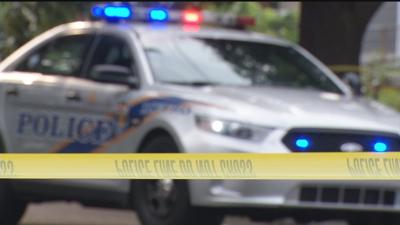 LMPD CAR WITH LIGHTS AND CRIME SCENE TAPE