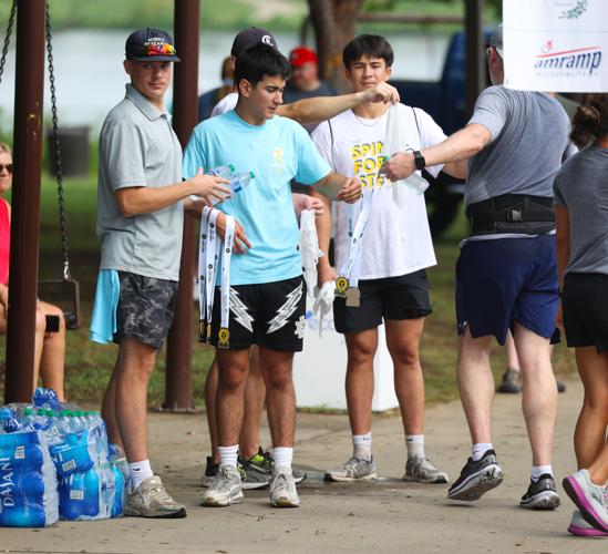 Medals handed out at finish line at Race to Cure Sarcoma.JPG