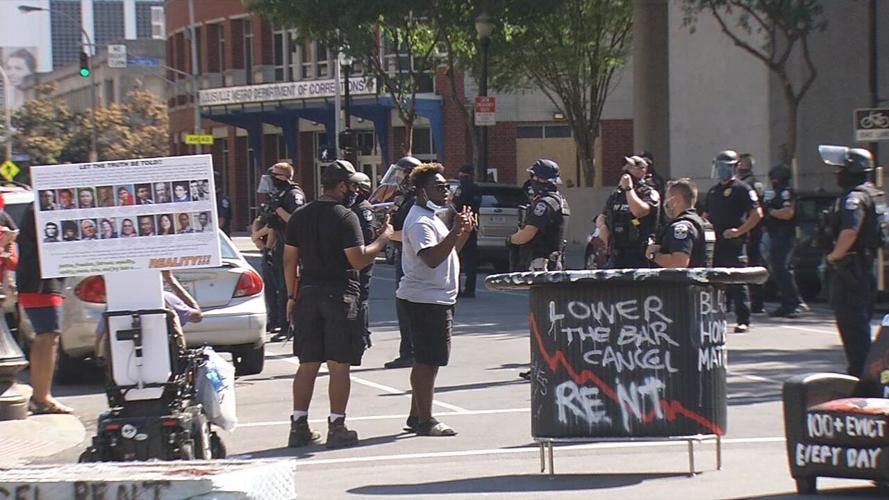 Anti-eviction protests protesters talk to police at 6th and Jefferson 8-8-20