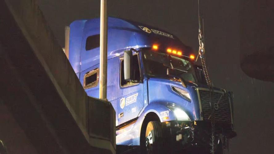 Swift semitruck dangle from I-65 overpass