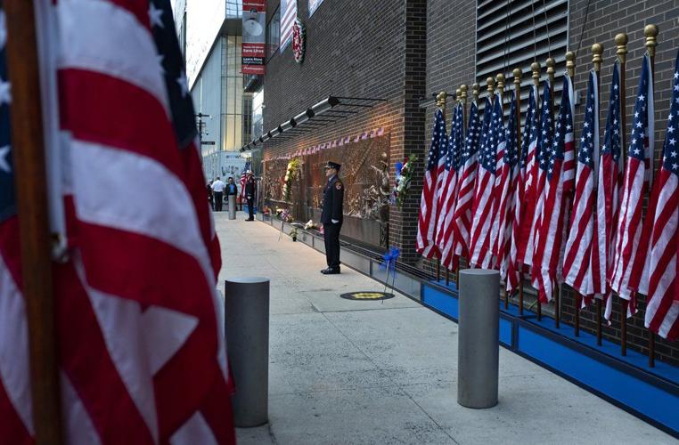 NYFD stands at attention in front of memorial near One World Trade Center.jpeg