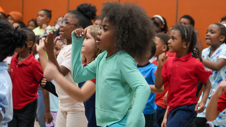 Students dance during Pajama Day - Engelhard Elementary.png