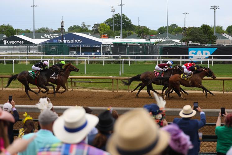 Horses move past crowd on Thurby -  May 1.JPG