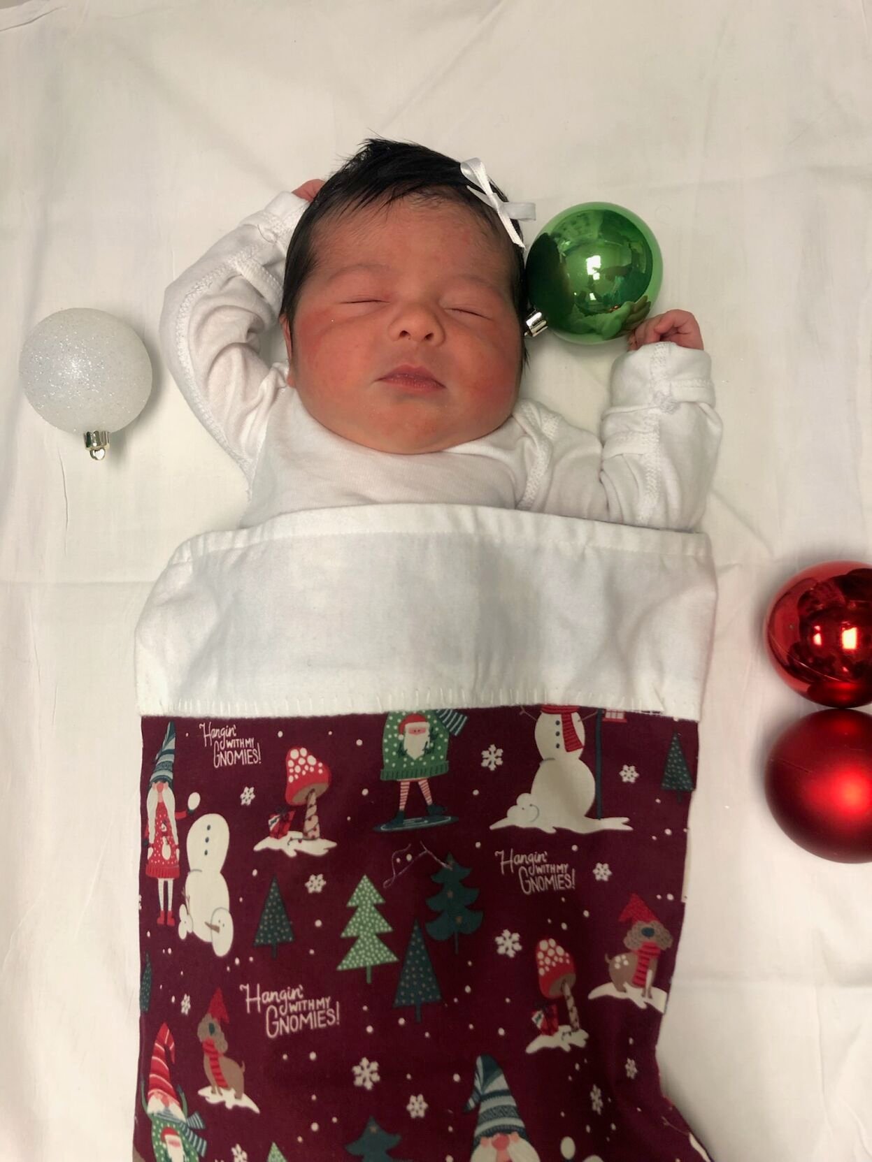 Baptist Health Hardin baby dressed in Christmas stocking