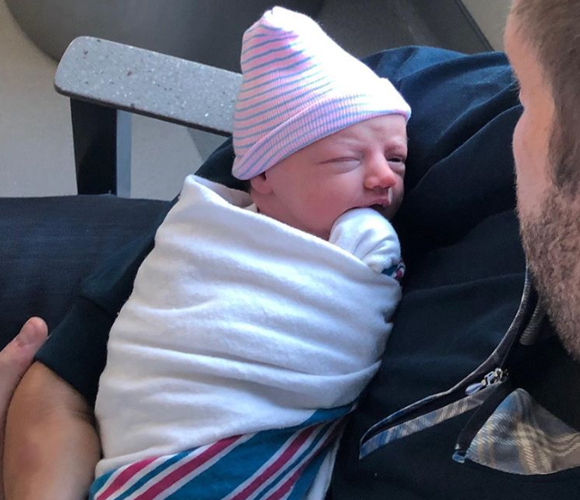 Eric Trump holding Baby Carolina