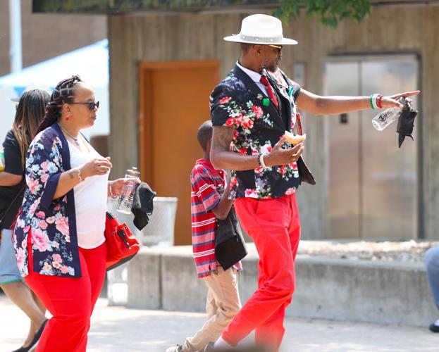 Man at Juneteenth Festival points to crowd.JPG
