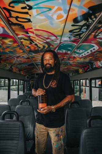 Local Kentucky Graffiti Artist Braylyn Stewart Inside One of the Eco-Friendly Propane Powered Buses That He Painted at The Bulleit Distilling Co. Visitor Experience - 2.0.jpg