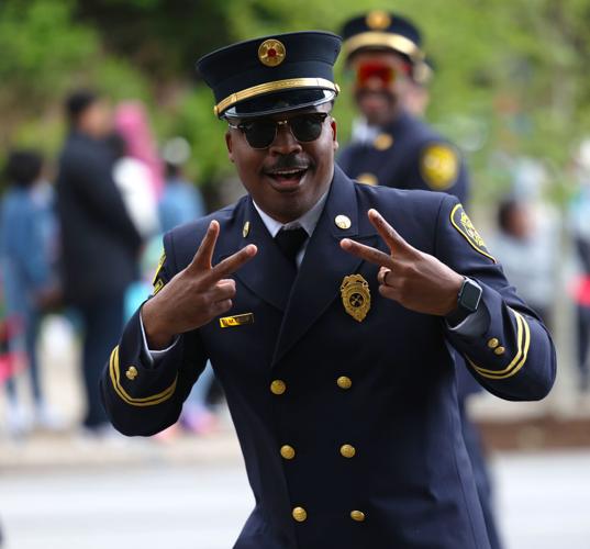 Firefighter poses for camera at parade.JPG