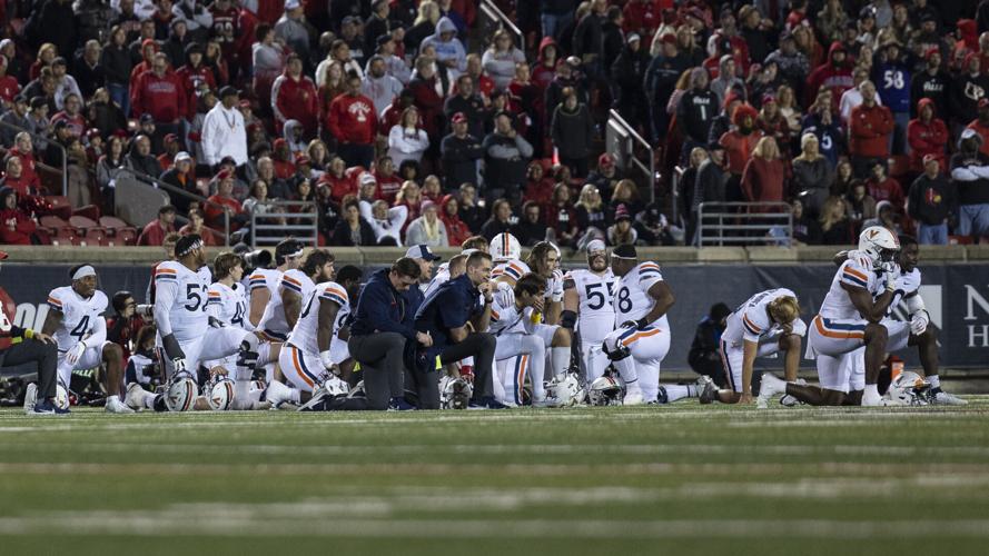 Virginia players kneel