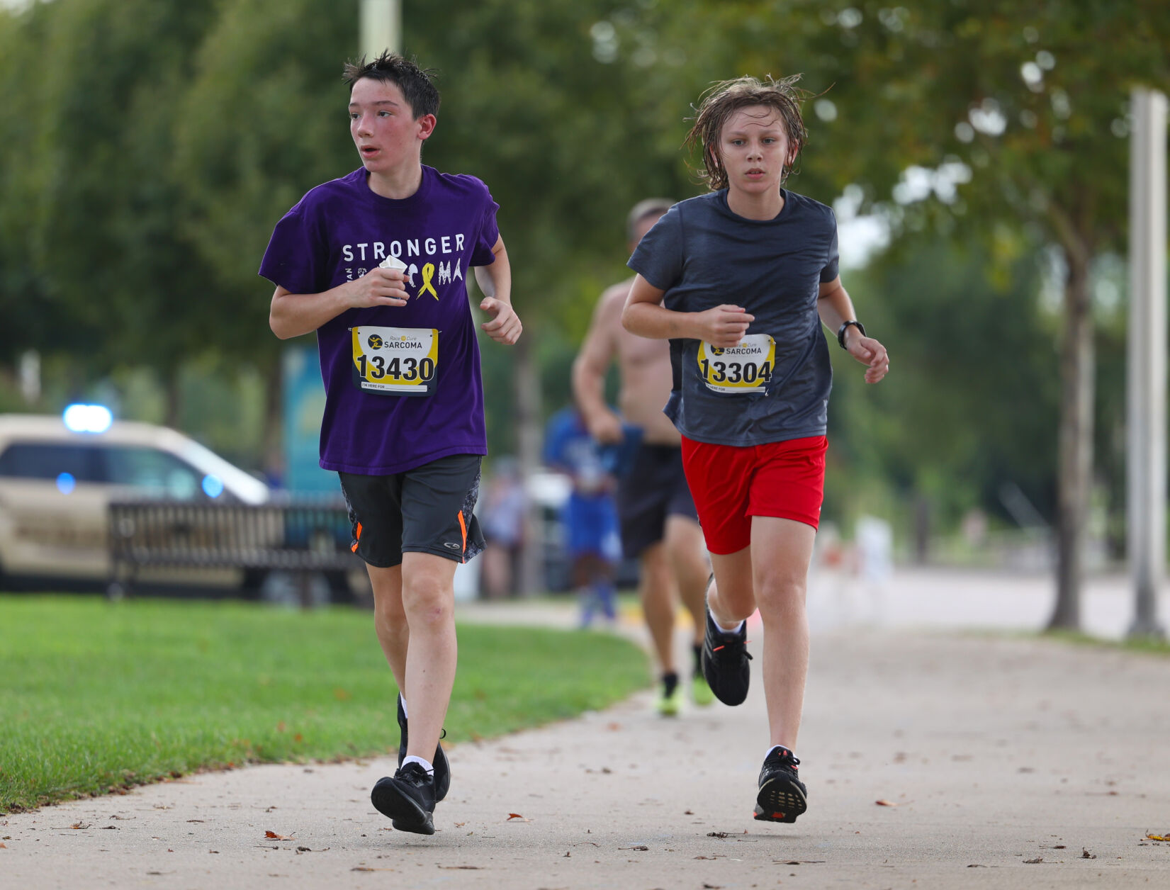 Two boys run in Race to Cure Sarcoma.JPG